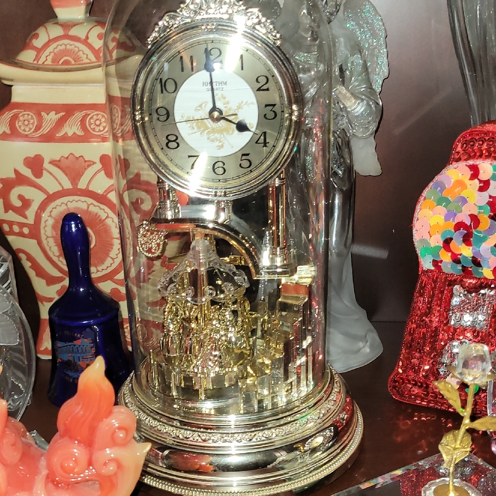 Elegant Gold and Silver Rotating Clock